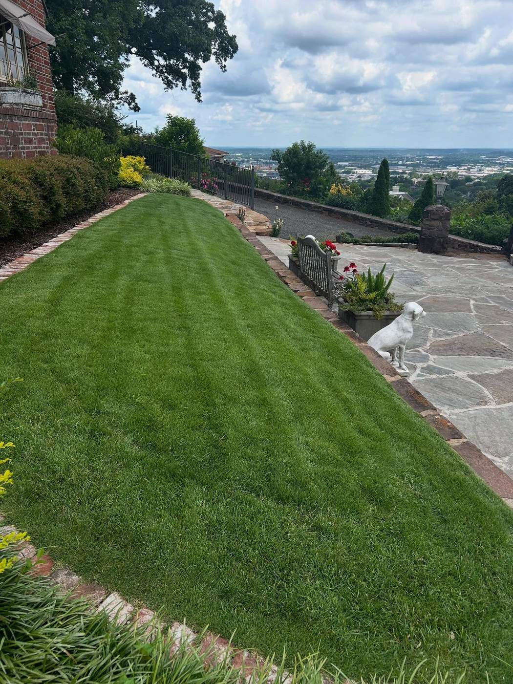 Manicured hillside lawn overlooking the Birmingham, AL metro, maintained by SOG Services
